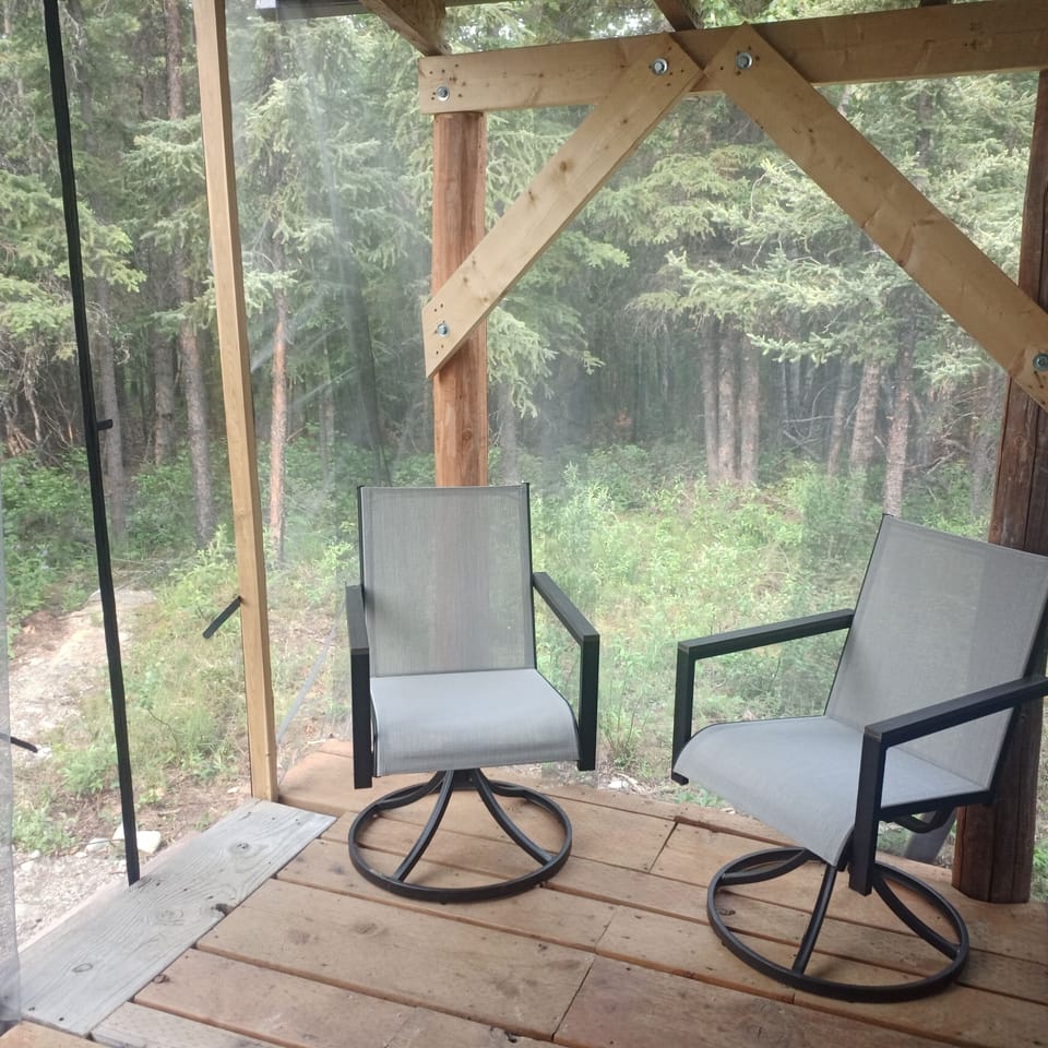 Relax on the screen porch in the Alaska wilderness