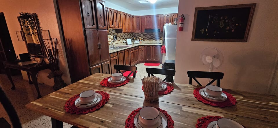 Another angle of the dining room and kitchen