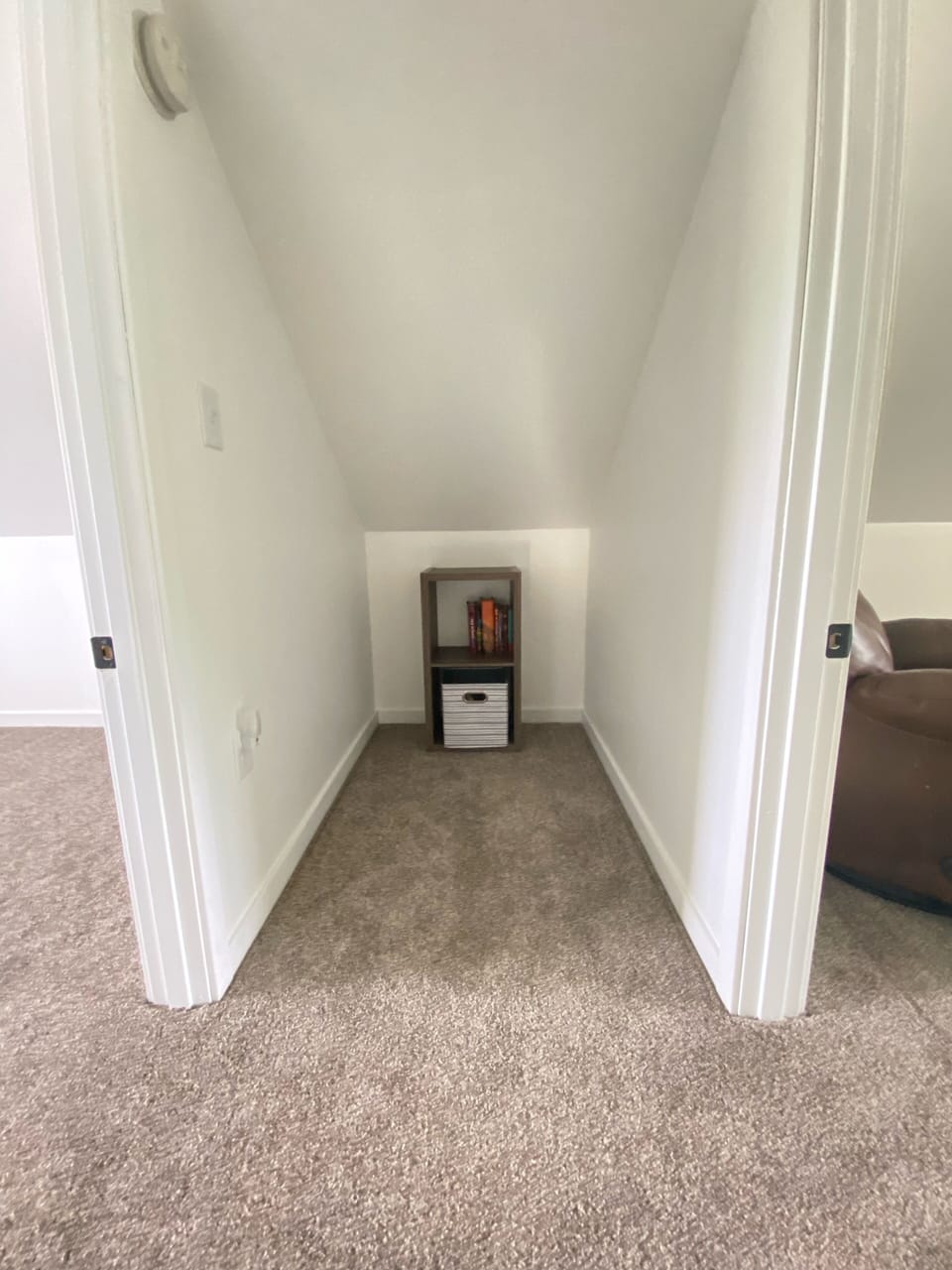 Hallway nook stocked with books for all ages