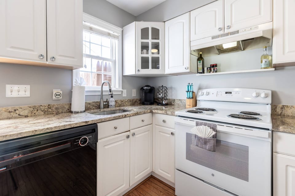 The kitchen has a view outside to the back patio.