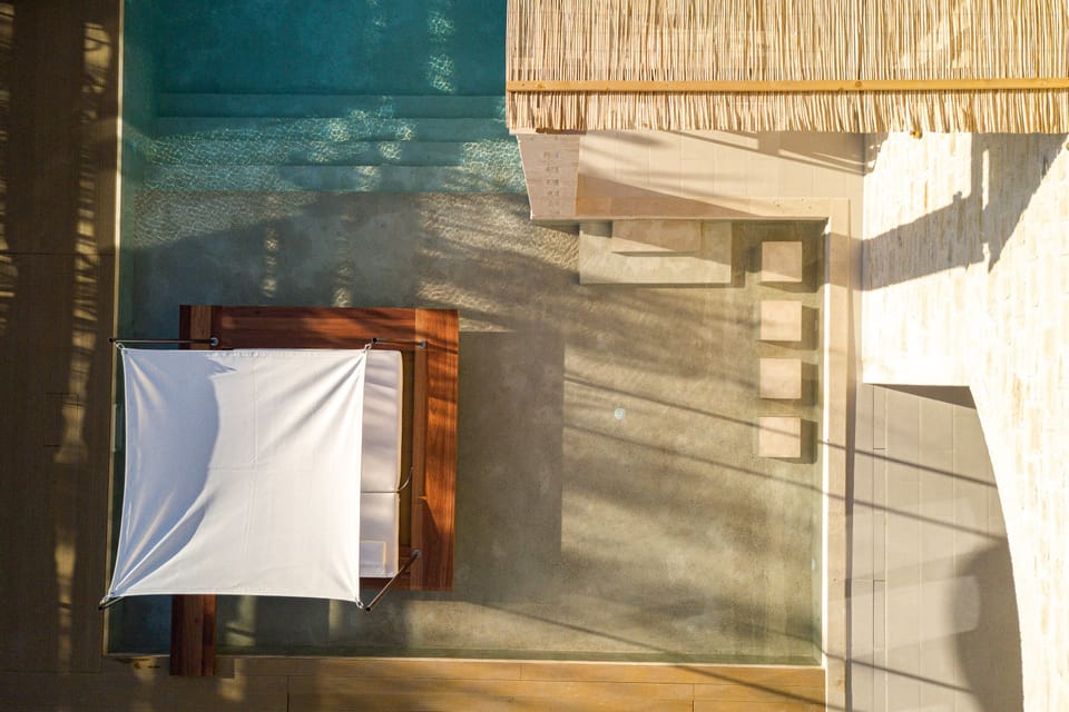 Indulge in a siesta on the iconic swim-up sun bed.