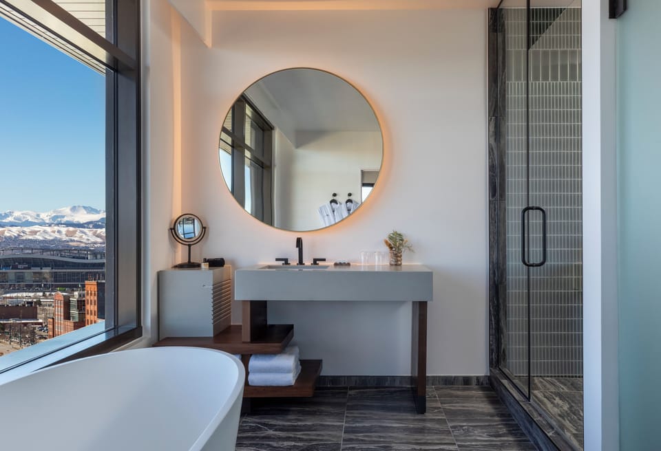 Suite (Mile High) | Bathroom | Designer toiletries, hair dryer, bathrobes, slippers