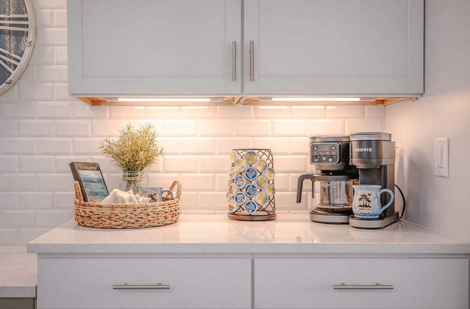 Right next to it is the coffee station, which becomes your best friend by Day 2. Under‑cabinet lighting, clean counters, and everything you need to get caffeinated before the sunscreen battle begins.