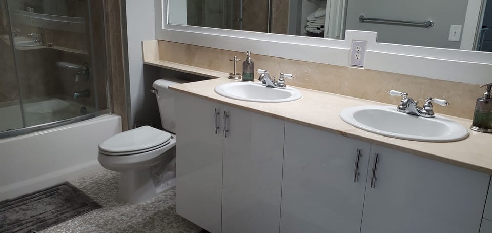Master bathroom very roomy and comes with double sink and towel closet. 