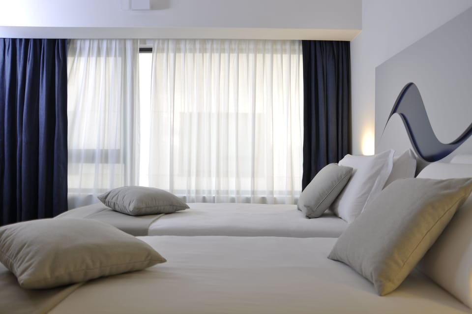 Hypo-allergenic bedding, down comforters, memory foam beds, minibar