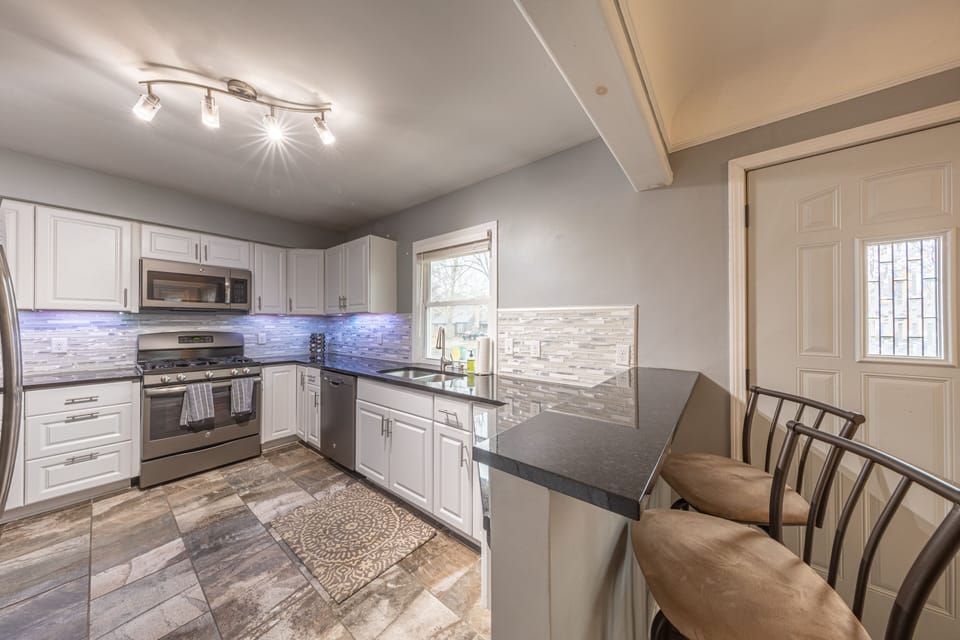 Large kitchen with SS appliances and granite counters