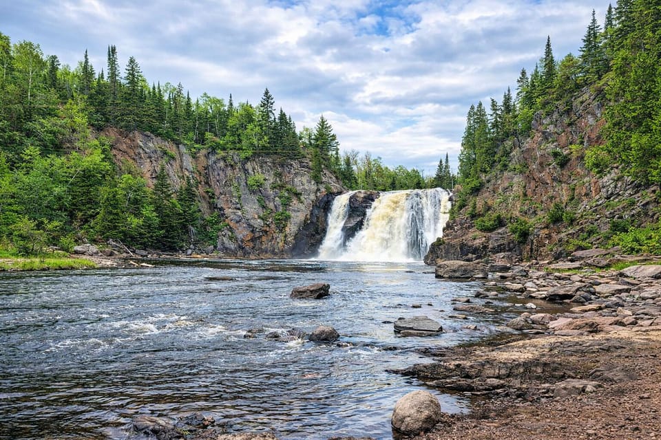High Falls at Tettegouche State Park, Spring runoff brings this powerful waterfall to life, framed by lush green foliage and dramatic cliffs. A must-see North Shore highlight just 11 minutes from the cabin and an unforgettable adventure.