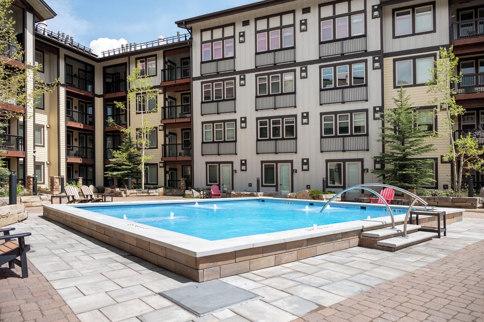 Dive into your own private oasis where crystal-clear waters invite you to unwind in this stunning courtyard pool sanctuary.