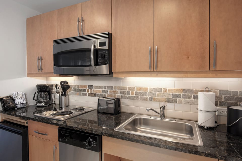 Your fully equipped kitchen awaits with granite counters, stainless appliances, and everything needed to prepare memorable meals during your stay.