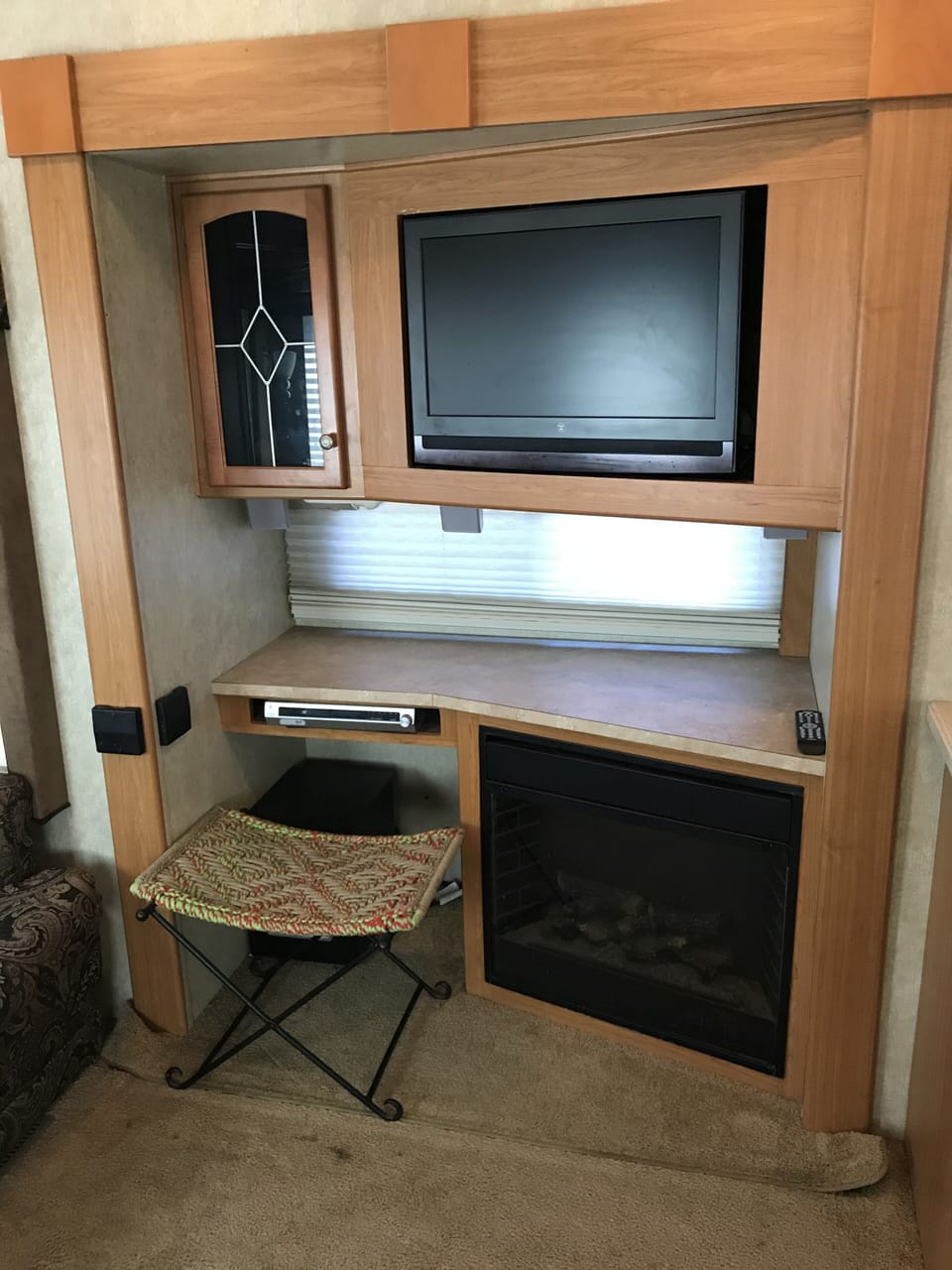 Entertainment center with DVD player and Surround Sound.