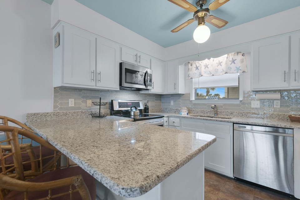 Prepare meals with ease in this bright and functional kitchen, designed for both everyday use and entertaining.