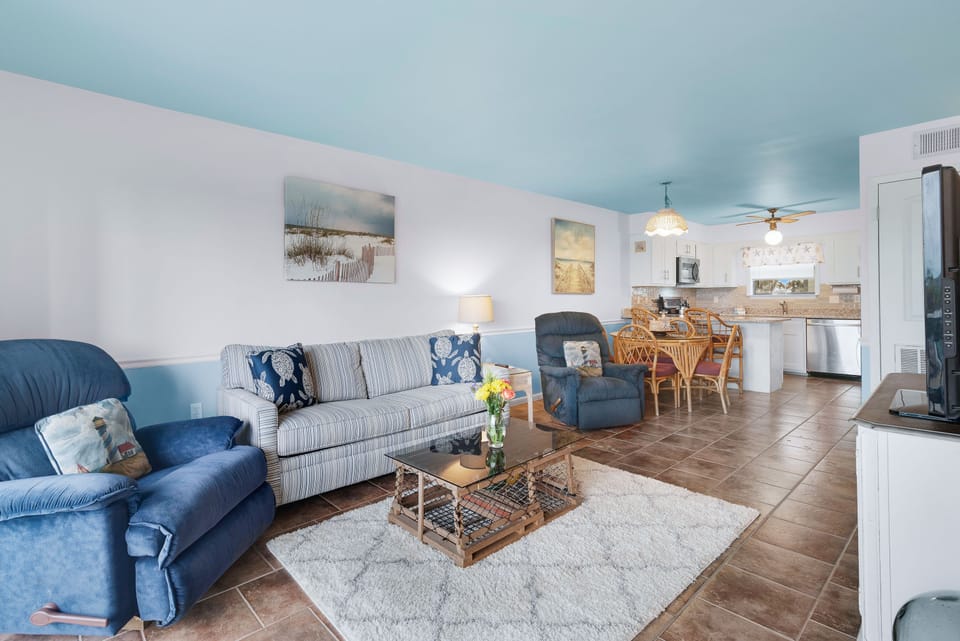 Enjoy the seamless flow of this open-concept living space, designed for comfort and connection.