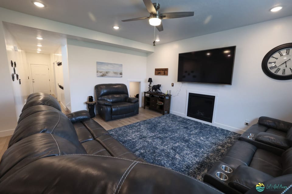 Family Room with working fireplace & large TV