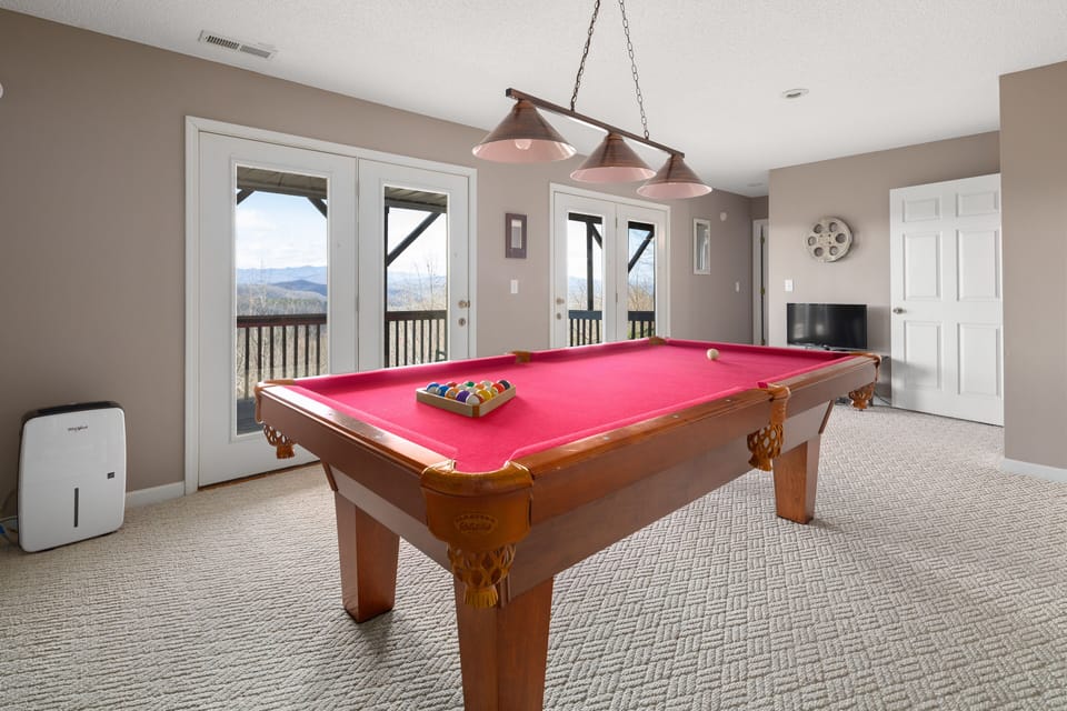 Game room with slate pool table, (airhockey and ping pong toppers)