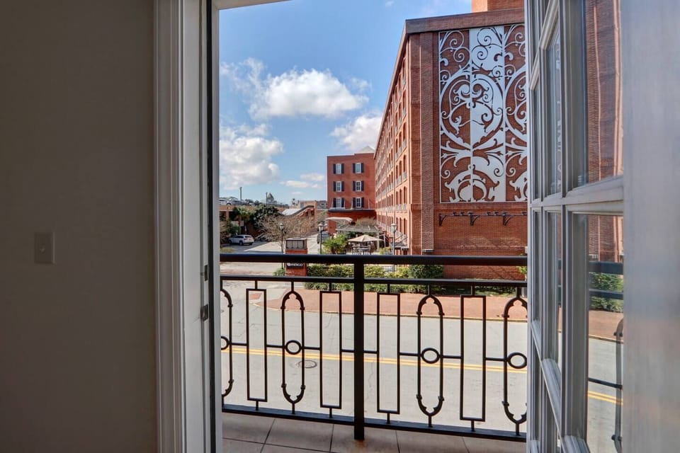 View from the walk out balcony. Look left to City Market and right to River Street.