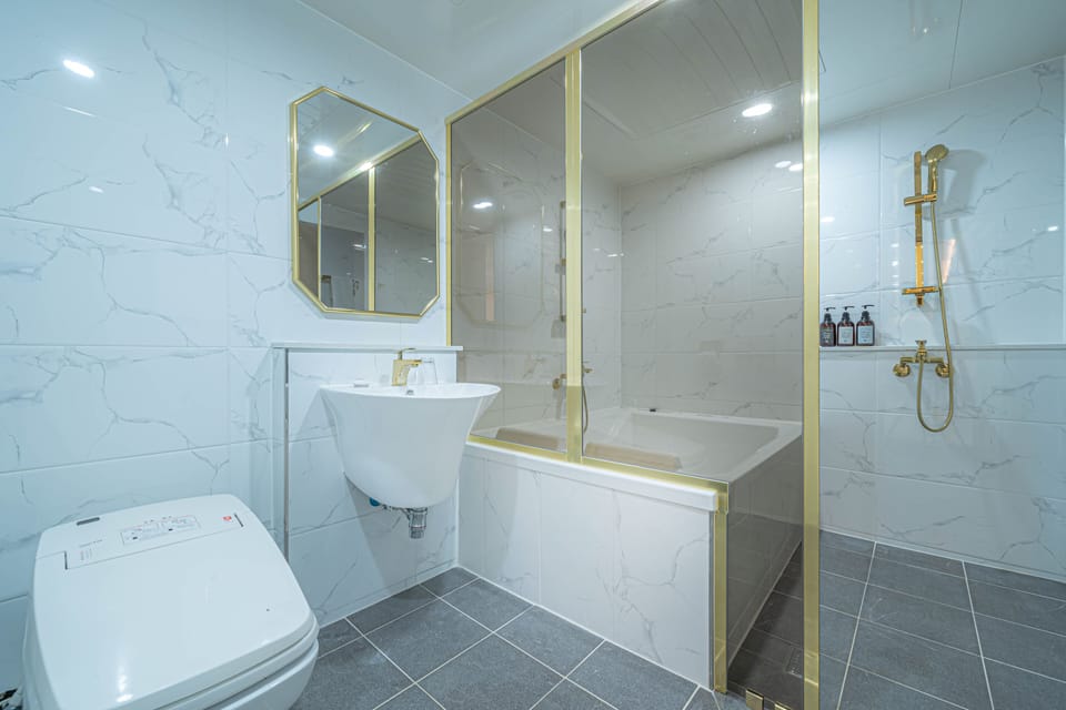Family Triple Room, Multiple Beds | Bathroom | Bathrobes, slippers, bidet, towels
