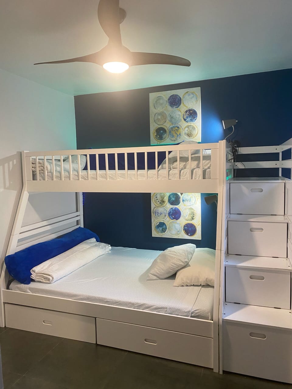 Full bed below with twin above. Plenty of storage underneath.