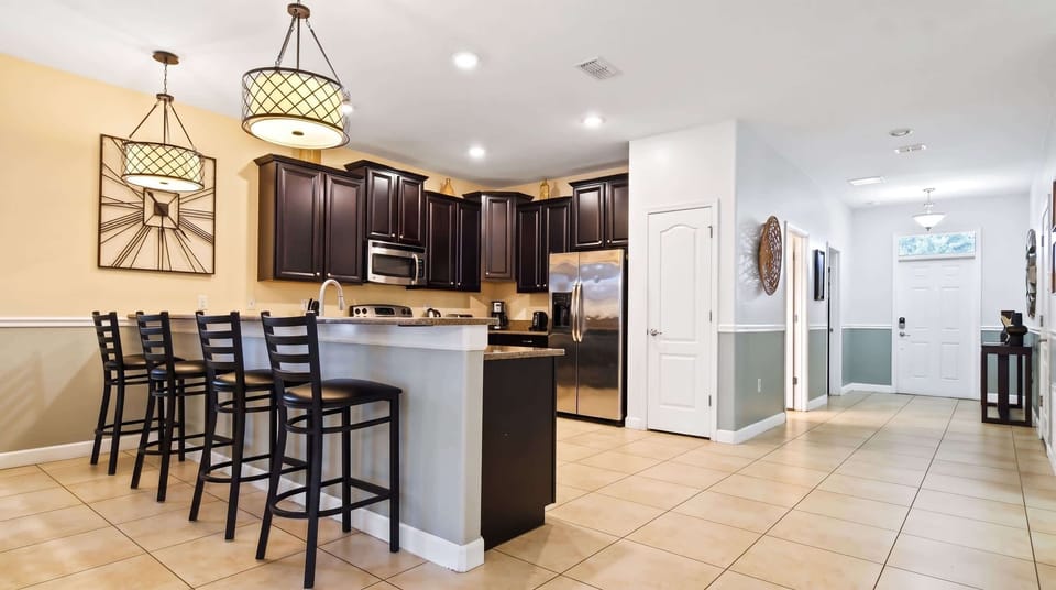 Modern kitchen seamlessly integrated with a sleek mini bar