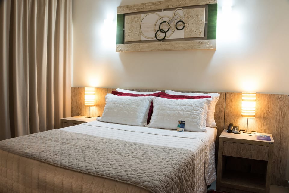 Deluxe Studio Suite, 1 Queen Bed | Minibar, in-room safe, desk, laptop workspace