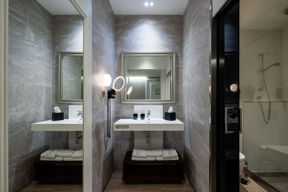 Eco-friendly toiletries, hair dryer, towels