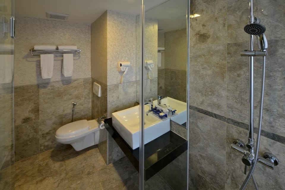 Shower, free toiletries, hair dryer, slippers