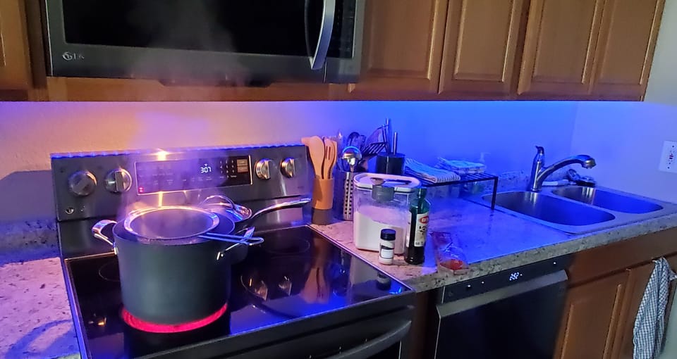 Fully equipped kitchen, new appliances, cooking/eating utensils, & food basics.