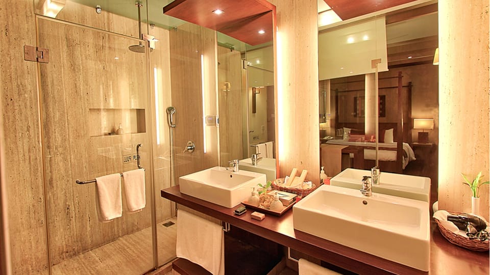 Angsana One Bedroom Pool Suite | Bathroom | Shower, rainfall showerhead, designer toiletries, hair dryer