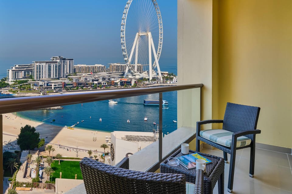 Suite, 1 King Bed, Balcony, Partial Sea View | Down comforters, minibar, in-room safe, desk