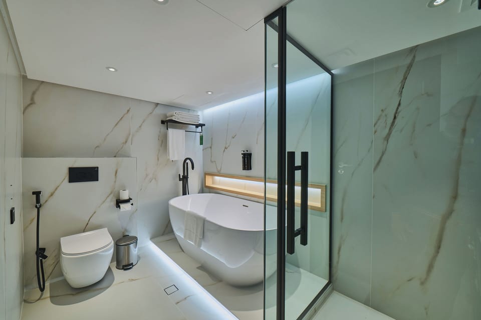 Separate tub and shower, eco-friendly toiletries, hair dryer, slippers