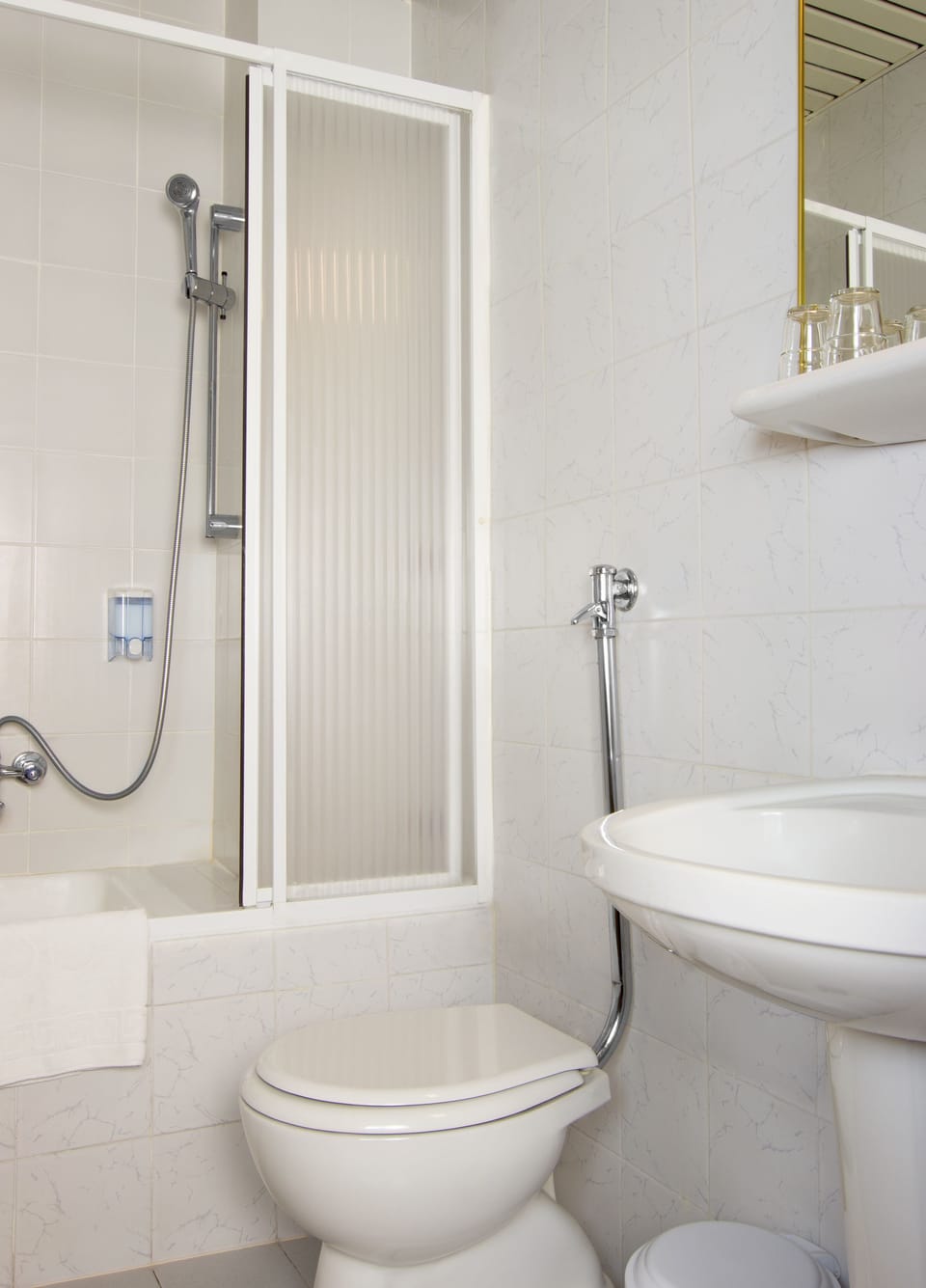Shower, hair dryer, slippers, towels