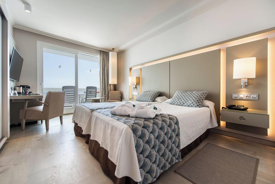 Minibar, blackout drapes, iron/ironing board, bed sheets