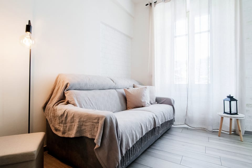 City Apartment | Living area | 30-inch flat-screen TV with digital channels