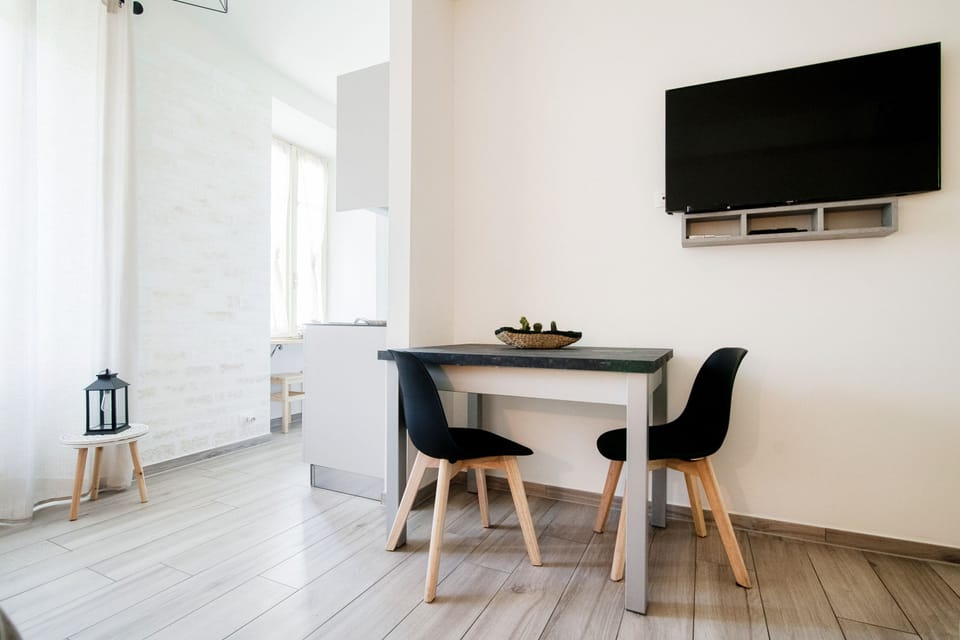 City Apartment | Living area | 30-inch flat-screen TV with digital channels