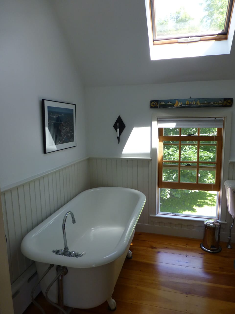 Upstairs bathroom with a claw foot tub.