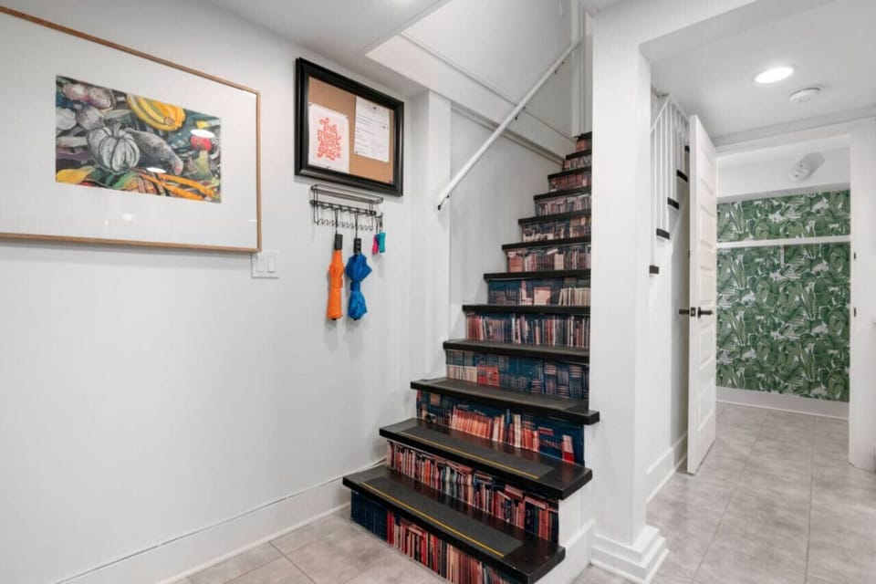 Uniquely styled staircase leading to main home with a secure locked door for privacy.Extra umbrellas for the Portland weather.