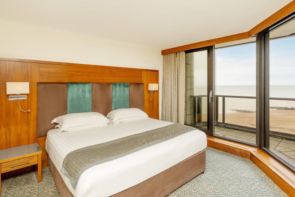 Family Room, Partial Sea View (Max 4 People) | In-room safe, desk, laptop workspace, iron/ironing board