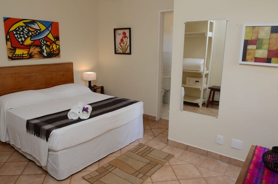 Double Room | Minibar, in-room safe, individually decorated, iron/ironing board