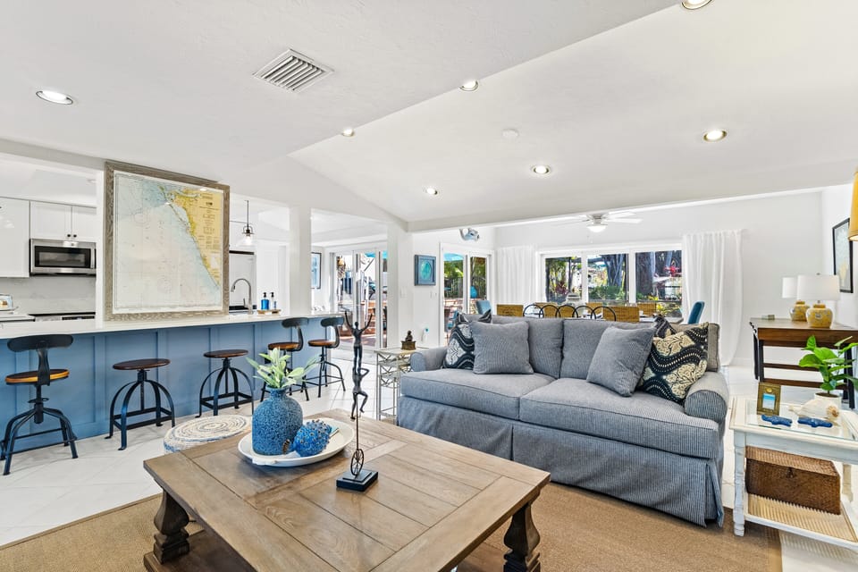 A few steps in, the living room with dining area in background.
