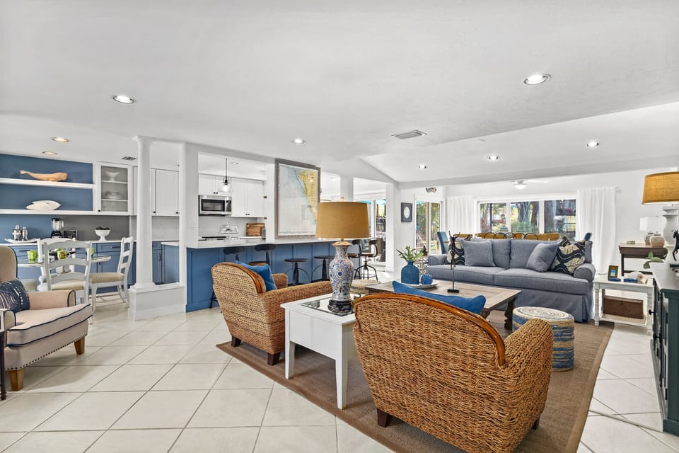 A "Show-It-All" indoor living space view.  Livingroom, Kitchen and dining area in the distance.
