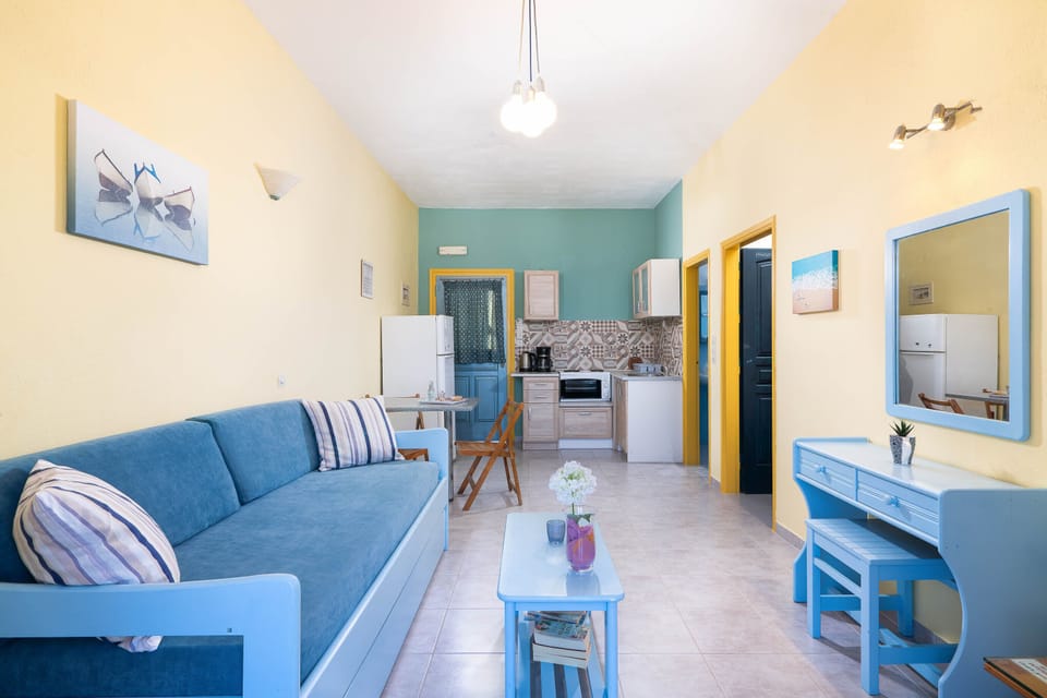 Superior Apartment, Sea View | Living area | 22-inch flat-screen TV with cable channels, TV