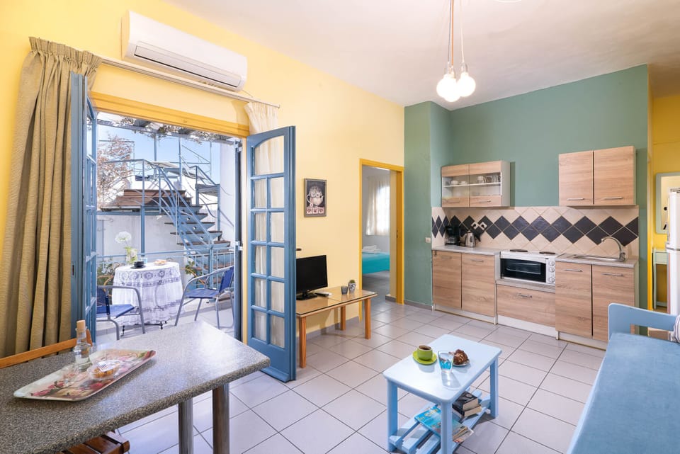 Superior Apartment, Sea View | Living area | 22-inch flat-screen TV with cable channels, TV