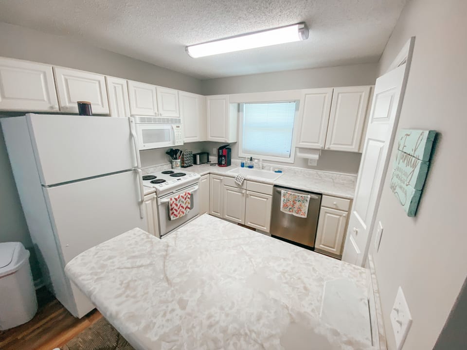 Kitchen is stocked with all basic dish ware and cookware to dine in