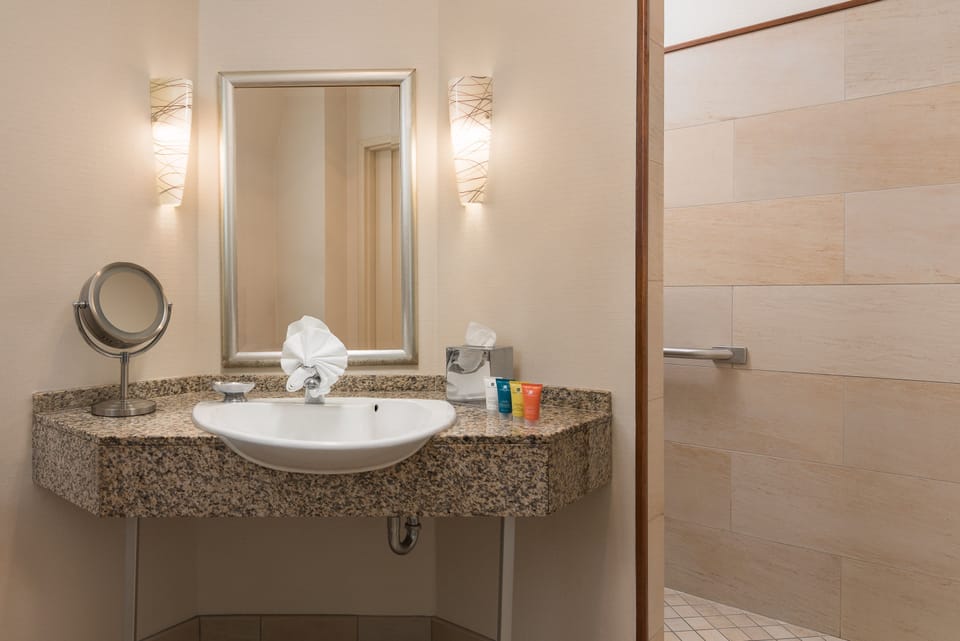 Shower, designer toiletries, hair dryer, bathrobes