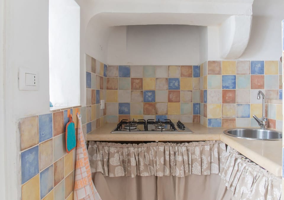 Apartment | Private kitchen | Full-size fridge, electric kettle, toaster, cookware/dishes/utensils