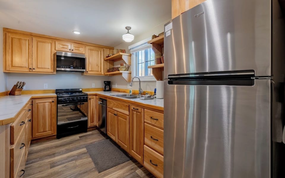 The bright, modern kitchen with full size appliances helps make meal prep a pleasure