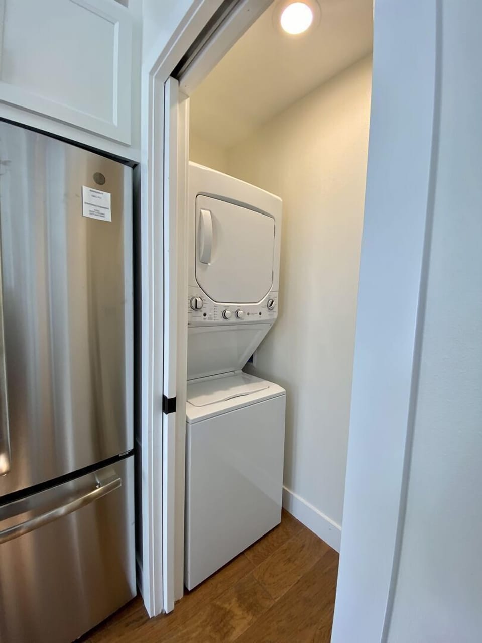 A washer and dryer provide added convenience for your stay, hidden behind a pocket door off of the kitchen