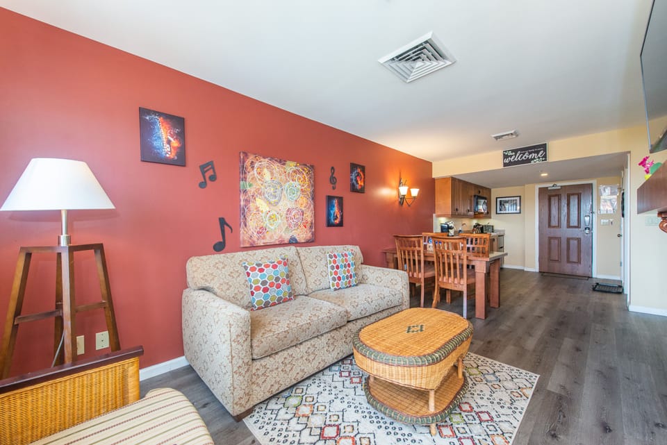 Vibrant colors, eclectic furnishings and fireplace - truly a one-of-a kind.