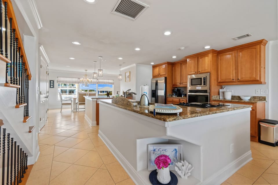 Granite, SS, and plenty of room for multiple chefs