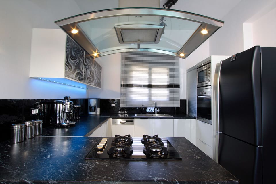 The kitchen is fully equipped with all modern appliances