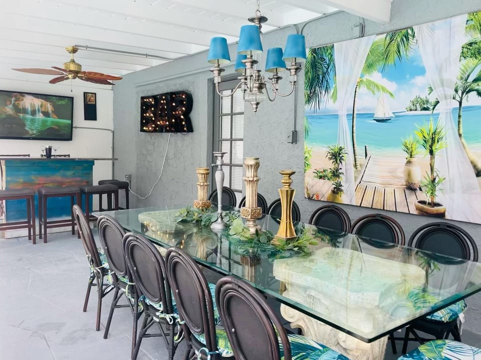 Our lanai is completely covered equipped with a large dinning table, bar, &TV